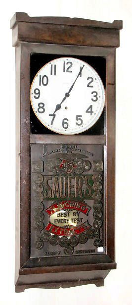 New Haven C.F. Sauer's Co. Wall Clock: New Haven C.F. Sauer's Co. Wall Clock: circa 1918; with a mahogany case; 12" dial and 8 day time only movement. Spring driven pendulum. The reverse on glass decoration is acid etched, decorated with g