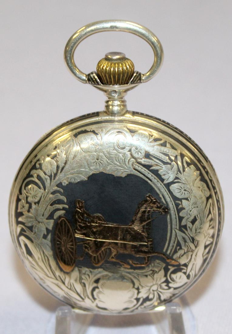 Niello 15 Ruby Jewel 42mm Pocket Watch: Niello Silver & Rose Gold 15 Ruby Jewel 42mm Pocket Watch: LS, bridge movement, in a HC marked Ancre Ligne Droit, 15 rubies, No.72392, a sulkey racer in gold on one cover, an anchor, cannon and other 