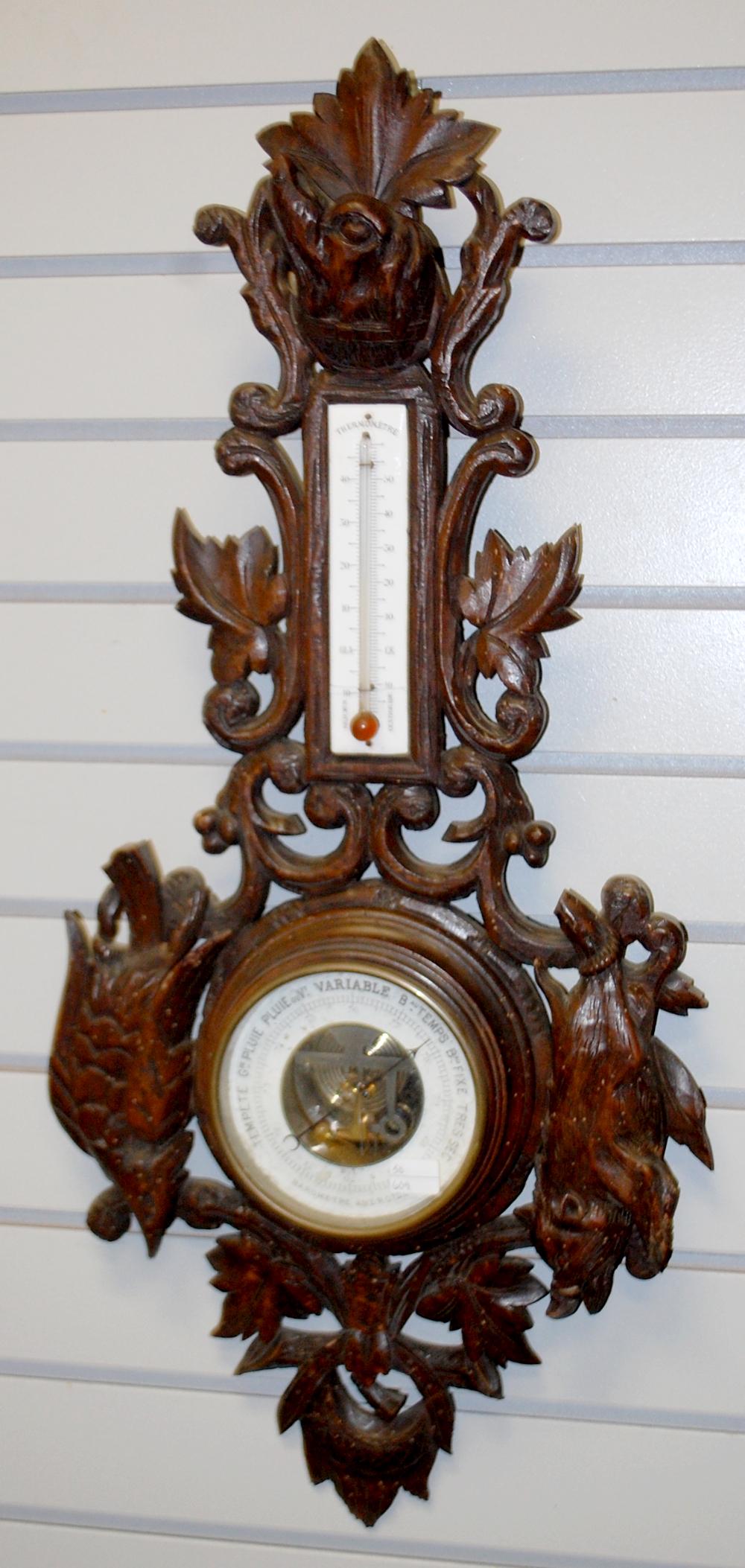 28" Carved Thermometer/Barometer: 28" Carved Thermometer/Barometer: carved dog, boar and bird.