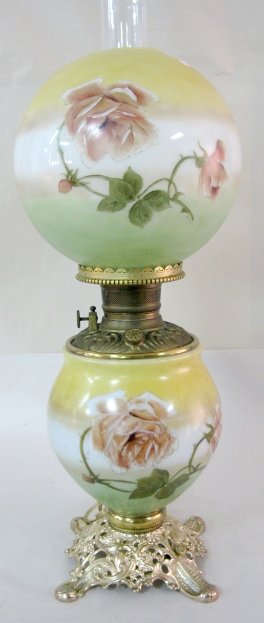 Rose Decorated Electric Gone With The Wind Lamp: Rose Decorated Electric Gone With The Wind Lamp: metal base marked Phoenix and 895; green, white and yellow painted bowl decorated with a thorny blooming rose; matching ball shade. Unmarked burner wit