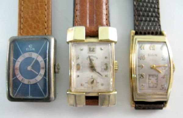 3 Elgin Wrist Watches: 21J, 15J & 17J: 3 Elgin Wrist Watches: 1.) Lord Elgin; 670; 21J; serial no.P530303; adjusted. In a yellow gold filled case with extended lugs and original double tapered crystal. Silver dial with gold hands, numbers 