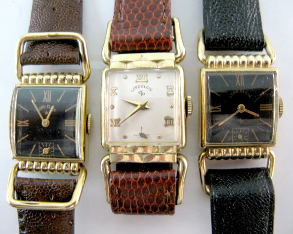 3 Lord Elgin Wrist Watches, 2 Black Dials: 3 Lord Elgin Wrist Watches, 2 Black Dials 1.) 21J, serial no.S581885; 4 adjustments; in a gold filled case. Black dial, gold hands, Roman numerals and markers, with a seconds bit. Running at this time