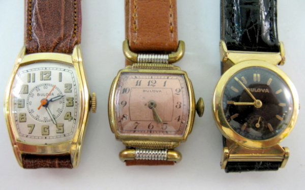 3 Bulova Wrist Watches: 17J, 15J & Other: 3 Bulova Wrist Watches: 1.) 10AN; 17J; serial no.6002381; adjusted. In a yellow gold filled case with 1936 engravings. Round black dial with gold features. Not tested, no stem. 2.) Movement gives no i