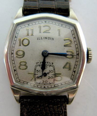 Illinois Blackstone 17J Wrist Watch: Illinois Blackstone 17J Wrist Watch: marked on works Illinois Watch Springfield; 607; 17J; serial no.544928lina Wadsworth 14K gold filled watch case, numbered 8568467. Ivory colored dial with gold num
