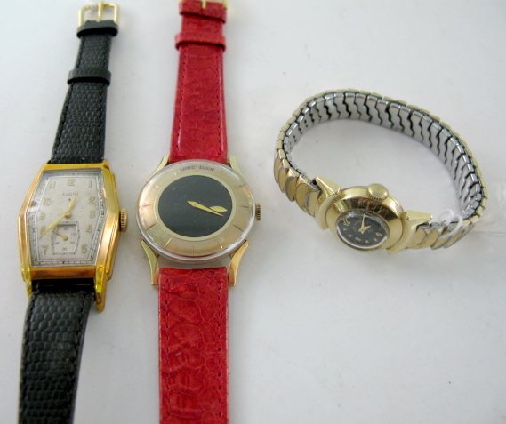 Elgin, Lord Elgin & Lady Elgin Wrist Watches: Elgin, Lord Elgin & Lady Elgin Wrist Watches: 1.) Elgin U.S.A. 15J; serial no.35555771. In a Wadsworth 10K gold filled case, numbered E036110. Ivory colored dial with gold numbers; seconds dial at 6; 