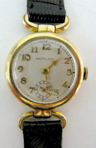 Hamilton 17J 10K Gold Filled Wrist Watch: Hamilton 17J 10K Gold Filled Wrist Watch: serial no.445068; 987-E; in a Wadsworth 10k gold filled case, numbered 0916612. Silver colored dial with gold numbers; seconds dial at the 6. Running at this
