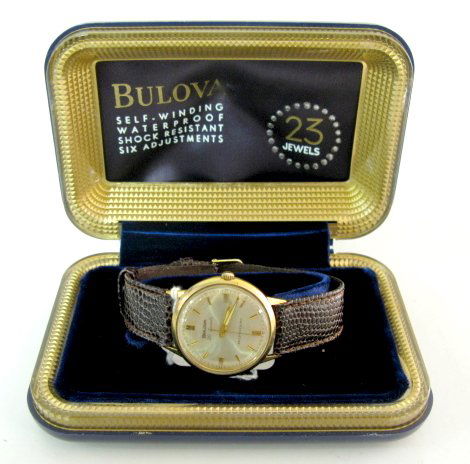 Bulova 30J Self Winding Wrist Watch: Bulova 30J Self Winding Wrist Watch: in a 10K RGP Bulova case; Antimagnetic, Waterproof, Shockproof, numbered I979283. Gold colored dial with gold number indicators. Back not opened. In a Bulova 23J w