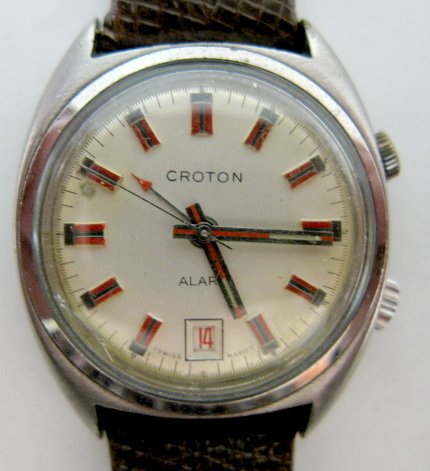 Croton Wrist Watch w/Alarm: Croton Wrist Watch w/Alarm: silver dial with red and silver hands and markers; not able to open the stainless steel case. Running at this time. All items sell As Is, Where Is, no guarantees of any kin