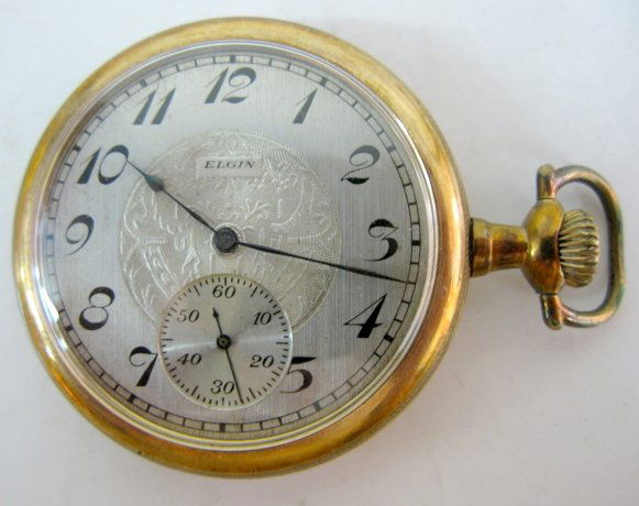 Elgin 15J 14S OF SW/SS DMK Pocket Watch: Elgin 15J 14S OF SW/SS DMK Pocket Watch: serial no.12820711. In a yellow screw on Philadelphia 20yr case, numbered 8439251. (Not running; the fancy silver dial is very clean.) All items sell As Is, Wh