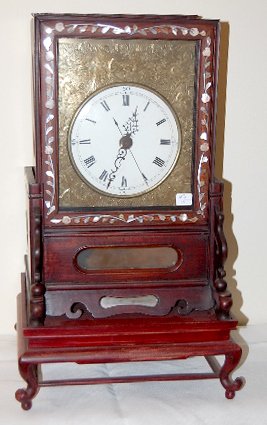 Chinese Double Fusee Shelf Clock: Chinese Double Fusee Shelf Clock: time and bell striking. 6" porcelain dial with engraved front plate bearing scenes of the mythical Foo dog. The mahogany case's front has inlaid shell designs and is 