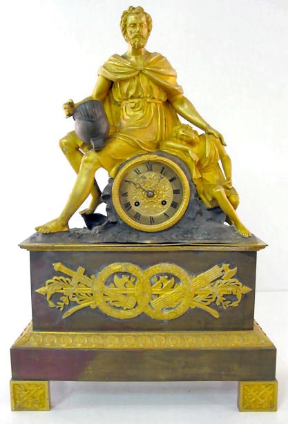 French Dore & Bronze Silk String Figural Clock: French Dore & Bronze Silk String Figural Clock: the time with half hour bell striking movement is numbered 2875. The dial with fancy center is 4" wide with a snake form as a bezel. The case is topped 