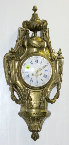 French Bronze Cartelle Hanging Clock: French Bronze Cartelle Hanging Clock: the time and bell striking movement is numbered 12159. The blue and white porcelain dial is 6" wide. The case is decorated with rams heads and bellflower like gar