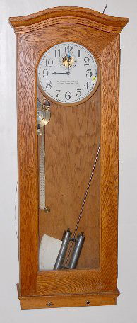Standard Electric Time Recorder: Standard Electric Time Recorder: it has a 12" dial in an oak hanging case; large 2 cylinder pendulum, no glass cylinders, is with it. Some electrical connections are inside. Not tested for running con