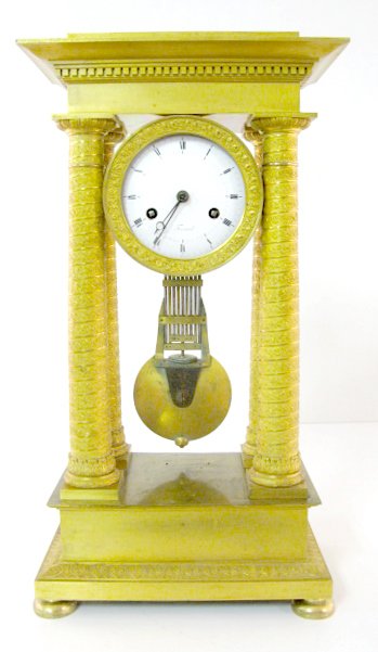 French Pinwheel Column Clock: French Pinwheel Column Clock: Bronze dore, 8 day time with ball striking, movement has a pinwheel escapement and free swinger style suspension. The 4 1/2" porcelain dial has "Frisard" and "A Rouen" on
