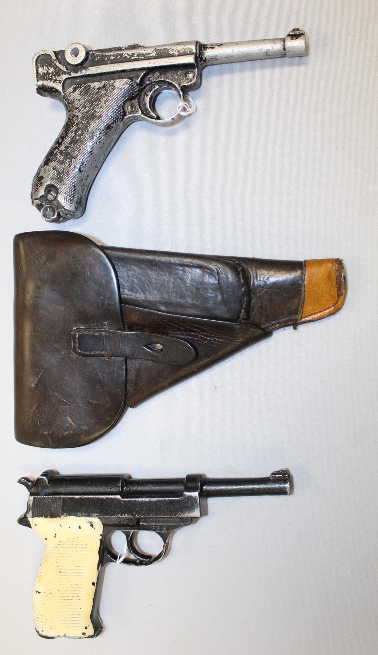 Walther P38 Soft Shell Holster w/ Replica P38: Walther P38 Soft Shell Holster w/ Replica P38 inside. The replica has no moving parts. The grips are painted white. It is about 8 1/8" long and shows use. Its condition still very good or better. Repl