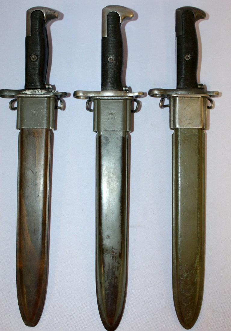 3 US Bayonets with Scabbards: 3 US Bayonets with Scabbards. 2 are for the MI Rifle. 1 is by Beretta 1955; one is marked AFH. The 3rd one is marked U.C, US. 1942. This one was modified from 16" to 16" blade. All are 14 1/2" long wi