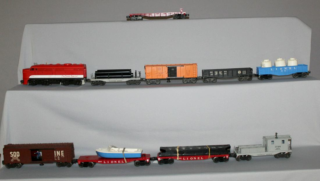 9 Lionel Railroad cars. Some have boxes: 9 Lionel Railroad Cars. Some have boxes. 1- No. 6800 flate care - no airplane - box is 12 1/4" by 3 1/2" - box ends missing. 2- No. 6802 flat car with finders in a 12 1/4"by 2 1/4" box with one bad en