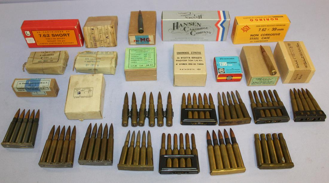 14 boxes and 10 clips of ammo: 14 boxes and 10 clips of ammo from several countries. Include 7.62 by 39" 45 cal, 30 cal, 7.65mm, some not translated, the flat clips have 5 rooms each.
