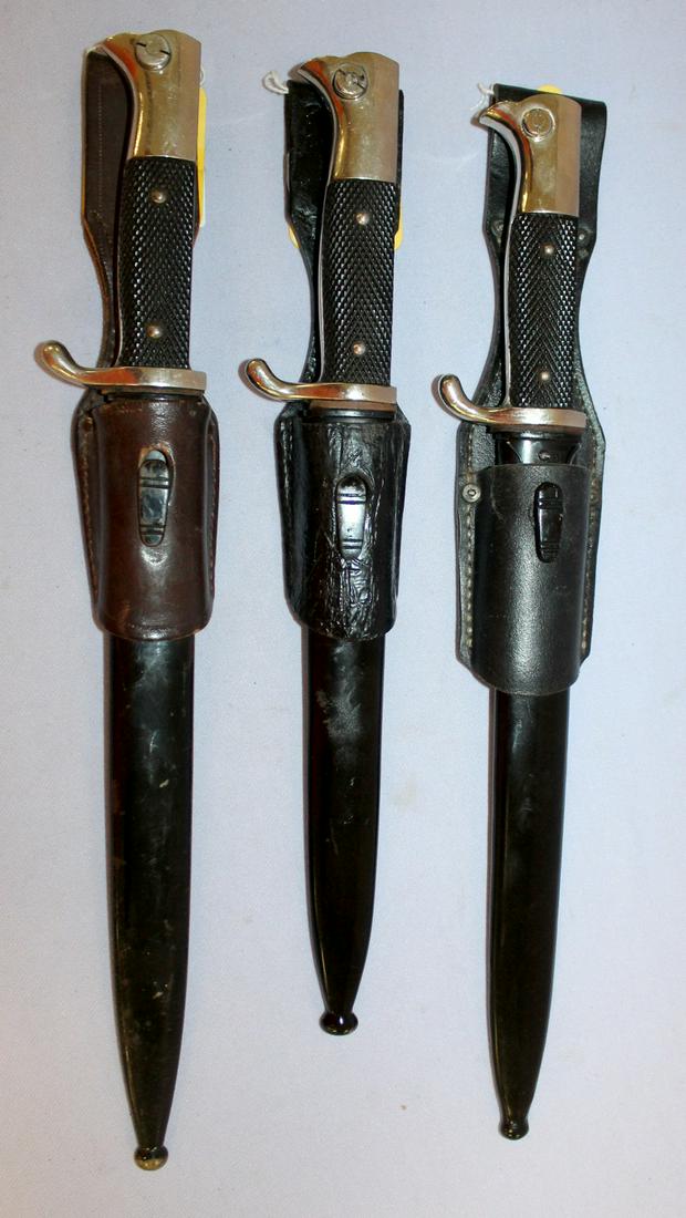 3 German WWII Dress Bayonets with Scabbards and Leather: 3 German WWII Dress Bayonets with Scabbards and Leather Hangers. One is marked with C.D Schaaf of solinger also a fisherman's head with pipe; one is marked PUMA-Solingen; one is unmarked, the bayonets