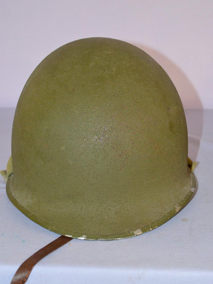 2 US Military helmets and 2 entrenching tools: 2 US military helemts and 2 entrenching tools. 1- WW1 M1917 doughboy hlmet, 12 1/4" long. 2- U.S.N. Mark 2 gunners helmet, 13" by 11 1/2". 3- WW2 entrenching tool, cover marked BBSCO 1943. Non solider