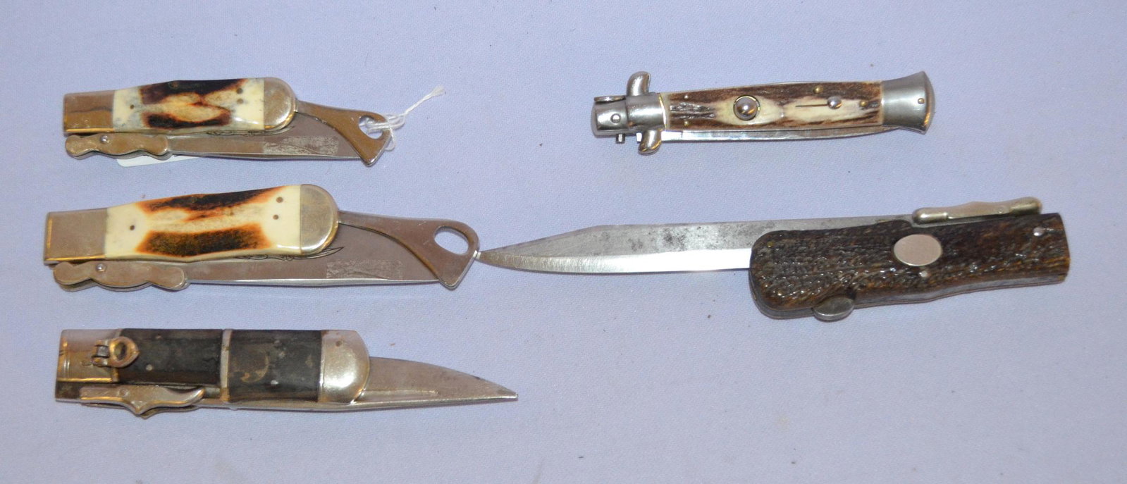 5 knives: 5 knives of japan, italy, and austria. 1-2-3- are japan long blades. 2 stay and 1 horn handles. 4- italy switch blade - stay handles 4 7/8" by 8 3/4". 5- awwadsworth - austria- stay handles. 8 1/4" an