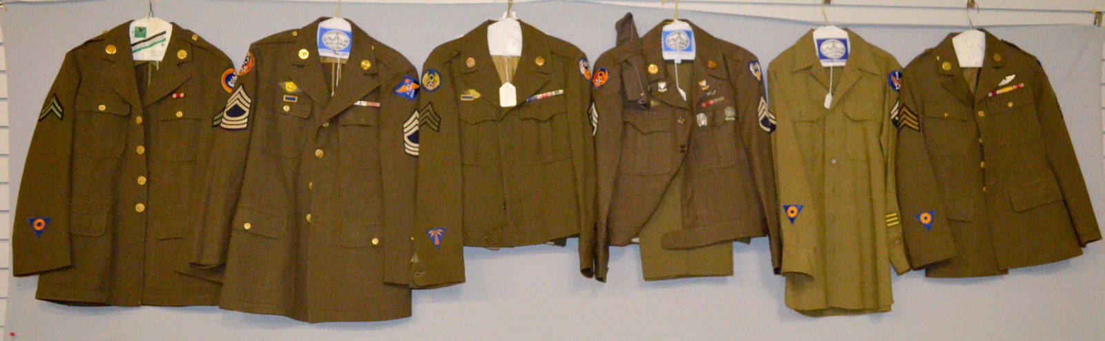 Military clothing: 1- coat with master sergent, 13 air force and far east forces patches. 2- coat with sergent, 2nd air force and AF engineering specialist, and silver wings patches. 3- Shirt with tech 5th grade and 1st