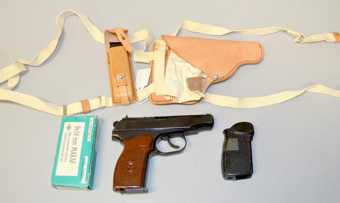 9mm Makarov Semi Automatic Pistol: 9mm Makarov Semi Automatic Pistol: with it is a leather shoulder holster ring, extra clip and original black grips, German made it is No.D4855 and No.61 made in East Germany it is 6 1/4"L, a partial b