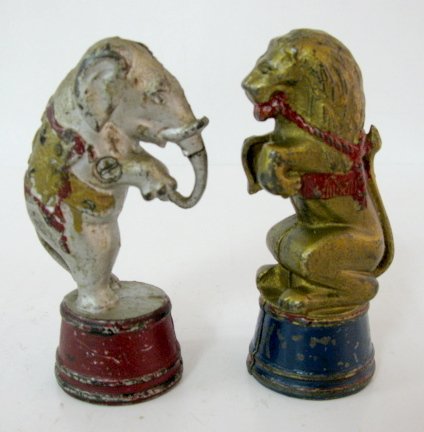 2 A.C. Williams Cast Iron Penny Banks: 2 A.C. Williams Cast Iron Penny Banks: 1.) A.C. Williams Elephant on a Tub (Some paint loss.) 5 1/2" 2.) A.C. Williams Lion on a Tub, decorated. (Slight paint loss.) 5 1/2" All items sell As Is, Where