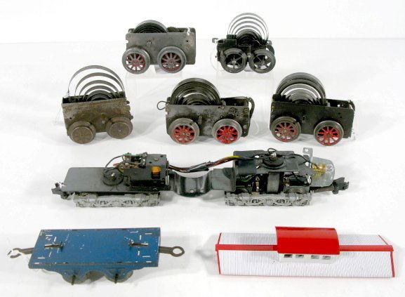 Box Lot of Train Motors & Parts: Box Lot of Train Motors & Parts: 1.) Karl Bub motor for small locomotives, works. 2.) Drofan wind motor, works. 3.) Ives wind motor, works, has brakes, dated 1926. 4.) Ives windup motor, 1912-1914, wo