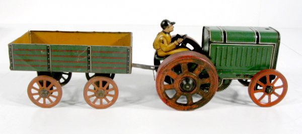 Gunthermann Tin Litho Fordson Tractor & Wagon: Gunthermann Tin Litho Fordson Tractor & Wagon: windup, works, all original paint. (Some paint corrosion, very nice example.) Tractor 6"; Wagon with hitch 6 1/2" All items sell As Is, Where Is, no guar