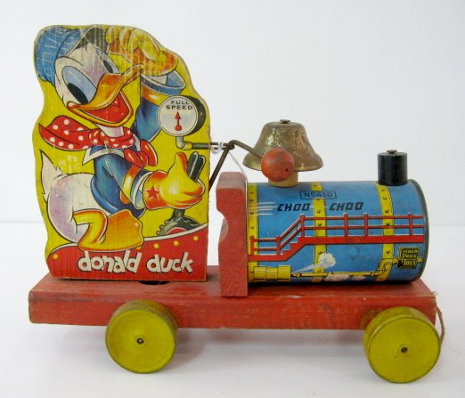 Fisher Price No.450 Donald Duck Pull Toy: Fisher Price No.450 Donald Duck Pull Toy: Donald Duck Choo Choo; complete, except for pull string. Introduced 1941. (Staining and wear to paper.) 7 1/4" x 8 1/2" All items sell As Is, Where Is, no gua