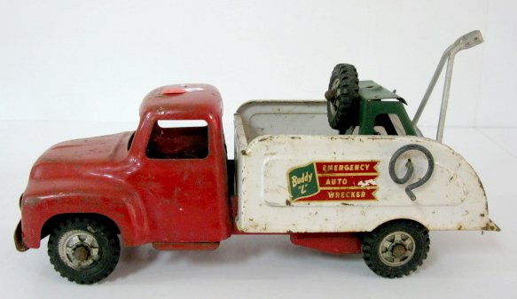 Steel Buddy "L" Emergency Auto Wrecker Toy: Steel Buddy "L" Emergency Auto Wrecker Toy: labels on truck box; tires all say Buddy "L" Toys East Moline, Illinois. (Pitted and rusty; part of towing apparatus is missing.) 7 1/2" x 14 1/4" All items
