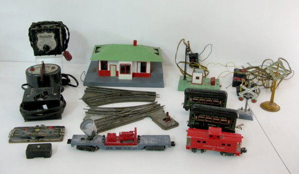 17 American Flyer Train Pieces: 17 American Flyer Train Pieces: 1.) A.C. Gilbert Co. American Flyer "Mystic" train station. 2.) 3 American Flyer Transformers: No.2; Model 8B and 1 with no model #. 3.) American Flyer Semaphore man. (