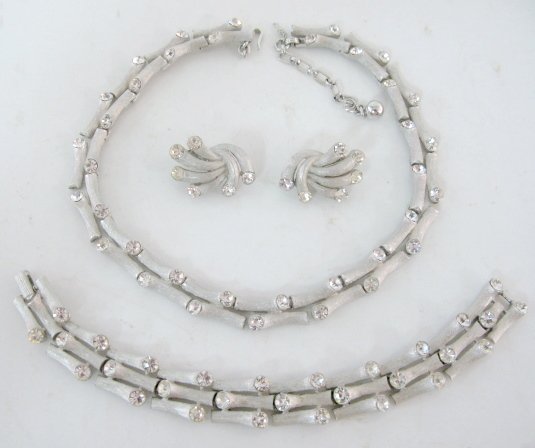 Marked Trifari 3pc Set in Original Box: Marked Trifari 3pc Set in Original Box: necklace, bracelet and earrings. (Some stains to box interior.) All items sell As Is, Where Is, no guarantees of any kind. We accept Mastercard & Visa, no paypa