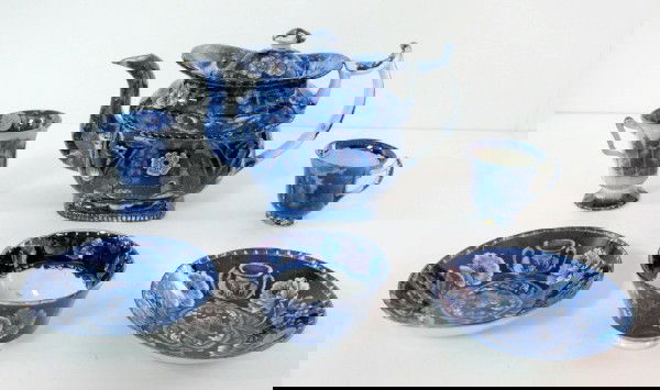 Flow Blue Tea Cups, Tea Bowls & Teapot: Flow Blue Tea Cups, Tea Bowls & Teapot: 1.) Tea bowl without handles, with 2 deep saucers. Decorated with poppy flowers and vases with the American eagle on them. There are 2 deep tea saucers that mat