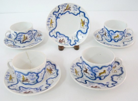 9pc French Sarreguemines Dinnerware: 9pc French Sarreguemines Dinnerware: marked Handgemalt and Adolph Stockhammer. Persian style decoration of blue lines and foliage. Also with hand decoration of rabbits in various scenes of riding a do