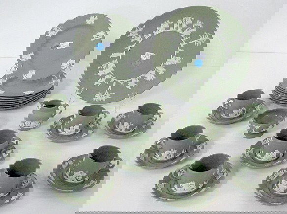 27pcs Wedgwood 1957 Green Jasperware: 27pcs Wedgwood 1957 Green Jasperware: dessert set with a 9 3/8" cake plate, 8 plates 6 5/8"; 8 cups 2 1/8" x 2", 8 cup plates 4 1/4"; a creamer and an open sugar. Olive green color with applied white