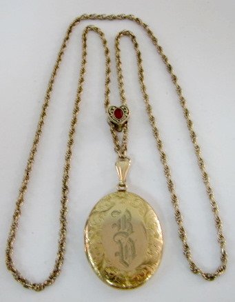 Rolled Gold Monogrammed Slide Chain Locket: Rolled Gold Monogrammed with R D, floral leaf decorated on the border with slide chain, heart slide has an oval red stone No condition problems. All items sell As Is, Where Is, no guarantees of any ki