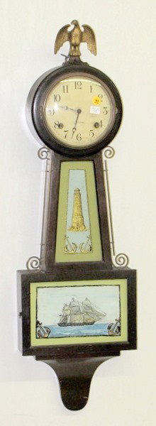 Sessions Banjo Clock w/Eagle Finial: Sessions Banjo Clock w/Eagle Finial: 8 day time with half hour gong strike and 6 1/2" celluloid dial. Both glass plates are reverse painted. Spring wound, no weights. In a mahogany case. (The dial has