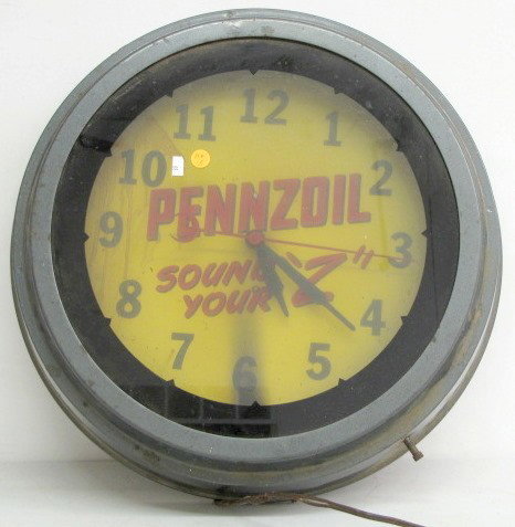 Electric Penzoil Advertising Clock: Electric Penzoil Advertising Clock: Penzoil Sound Your "Z" is on the 13 1/2" dial. The glass front is 16" wide. The white neon light works. (The cord is bad. The light has scorched the dial where its 