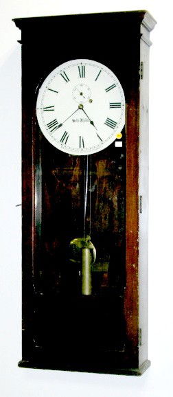 Seth Thomas 1 Weight Hanging Regulator: Seth Thomas 1 Weight Hanging Regulator: not identified, it has an 12" dial that is very clean and may not be original. In a mahogany case with a storage compartment below the pendulum. With a crank st