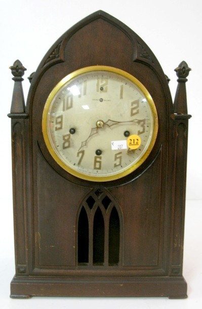 New Haven Gothic Case Chime Clock: New Haven Gothic Case Chime Clock: strikes on 4 straight rods every quarter hour and has a 5 1/2" silvered dial. In a gothic style case made of mahogany and veneer. (The chimes do not activate. No key