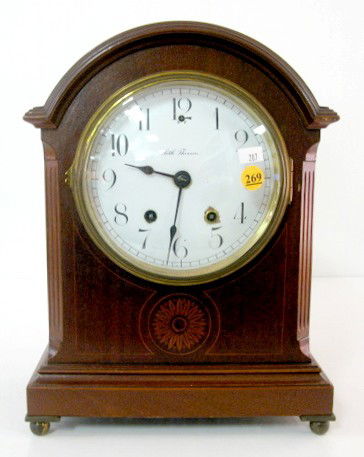 Seth Thomas "Tory" Mantle Clock: Seth Thomas "Tory" Mantle Clock: 8 day time with half hour gong strike. In a floral inlaid mahogany case. With a 6" porcelain dial. (The dial has chips around the key slots. Running at this time, the
