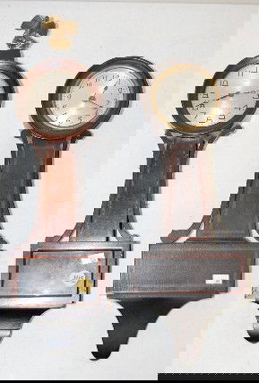 2 Miniature Banjo Clocks: Seth Thomas & New Haven: 2 Miniature Banjo Clocks: 1.) Seth Thomas with a 4 jewel, fixed key wind movement and a 3 1/2" silvered dial. In an inlaid, all wood case. (Missing its finial.) 16 1/2" long and running at this time 2