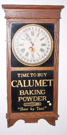 Oak Sessions Calumet Advertising Clock: Oak Sessions Calumet Advertising Clock: hanging with a 12" dial and time only movement. Calumet Baking Soda is on the lower glass plate. With original pendulum and a good interior label. No key. (The