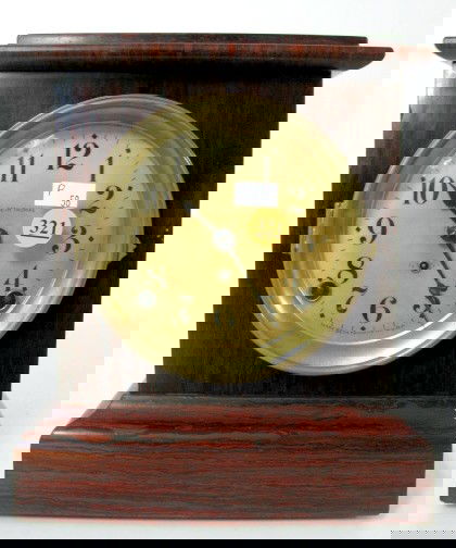 Seth Thomas Adamantine Mantle Clock: Seth Thomas Adamantine Mantle Clock: rosewood finish with a 5 1/2" dial. The dial is some kind of plastic material. 8 day time with half hour gong strike. (Time of strike is reversed. The dial is dark