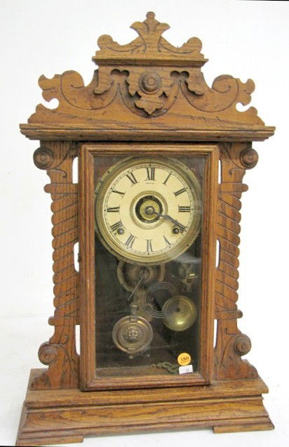 Oak Seth Thomas Kitchen Clock: Oak Seth Thomas Kitchen Clock: 8 day time with gong strike and a bell striking alarm. With a 6" dial. In an oak case. With key. (The dial has begun to darken. The wood finish is rough. Running, but th