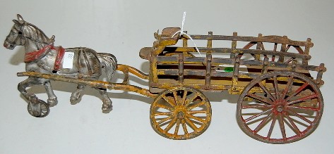 Cast Iron Hay Wagon & Horse: Cast Iron Hay Wagon & Horse: unmarked; horse has a wheel under its front hoof for easy rolling. (Reins are gone; connector for wagon and horse team gone; overall paint loss; in as played with conditio