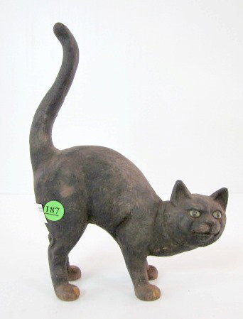 Cast Iron Crouching Cat Doorstop: Cast Iron Crouching Cat Doorstop: original paint. (Corroded.) 11" x 8 1/4" All items sell As Is, Where Is, no guarantees of any kind. We accept Mastercard & Visa, no paypal, no personal checks, no mon