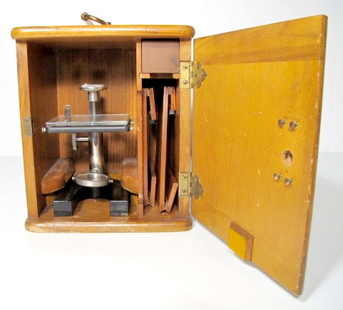 Bausch & Lomb Microscope Parts: Bausch & Lomb Microscope Parts: serial no.28546 in an oak carrying case. This seems to be only a base with reflective mirror and one small lens. (Has some nicks, but not bad.) 9 3/4" x 8 1/2" x 7 1/2"